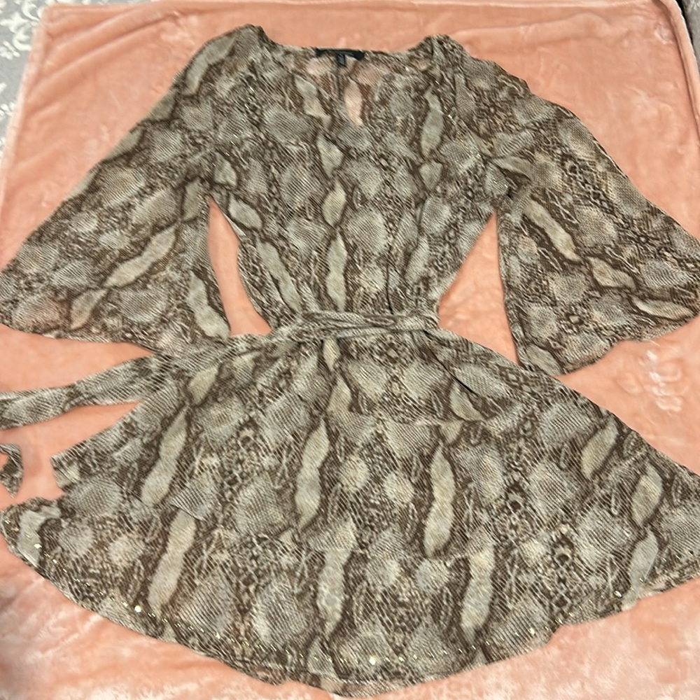 White House Black Market Snake Print Shear Dress with gold studs.